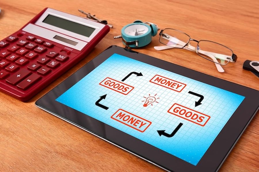 Une tablette affichant un cycle économique sur un bureau de travail pour comprendre comment identifier et s'inscrire sur les annuaires sources des réponses d'IA générative.